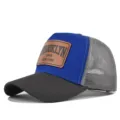Blue and black mesh trucker hat with a brown leather patch featuring Brooklyn text design. - Dark Gray & Blue (Gray Mesh)