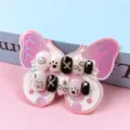 Detalle en primer plano de uñas postizas de dibujos animados en tarjeta de mariposa. - Perro Romántico (Tipo Pegamento de Gelatina)