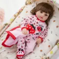 Detail of cute reborn baby doll wearing pink ladybug onesie and matching cute shoes. - Pink Ladybug Jumpsuit (Q18-072-072-01)