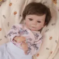 Reborn baby doll detail view, 45cm realistic vinyl infant toy with floral outfit for kids. - Pink Flower White Pants Set (Q18-074-064)