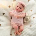 Poupée bébé reborn réaliste de 20 pouces en vinyle souple jouet pour enfant avec jolie tenue rose. - Style Barboteuse Rose (Sans Peluche) (Q20-006-056) / Poupée Reborn 50 cm