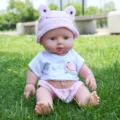 Bambola neonato in vinile da 30cm con cappello rana carino e variante di vestiti per bambini. - Stile Rana Rosa / Versione silenziosa da 30 cm