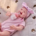 22 Inch Reborn Baby Doll Full Vinyl Simulation Infant Toy with Pink Outfit and Bottle - Pink Bow Romper Style (Q22-023-076) / 55cm