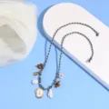 Bohemian braided anklet featuring a letter pendant, pearls, and shells for summer beach vacation. - Letter L