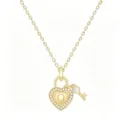 Close-up detail of gold heart lock pendant necklace featuring sparkling pavé crystals and letter Q. - Letter Q