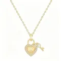 Closeup view of gold heart lock pendant necklace with sparkling crystal and letter R charm details. - Letter R