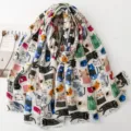 Close-up detail of the colorful cute cartoon cat pattern scarf, soft fabric texture. - Off White