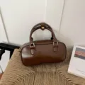Bolso de mano cilíndrico marrón minimalista para mujer, elegante bolso de hombro chic. - Marrón Sin Colgante
