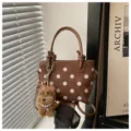 Brown polka dot bucket bag with cute dog pendant, stylish casual shoulder handbag for women. - Brown