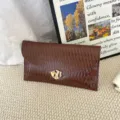 Stylish brown pleated envelope clutch bag for women, elegant commuter design with chic gold clasp. - Coffee