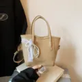 Stylish commuter tote bucket bag with pearl lace pendant, minimalist PU leather handbag for women. - Khaki With Pendant