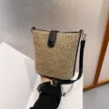 Summer straw bucket bag for women, stylish woven crossbody shoulder bag with black leather trim. - Black