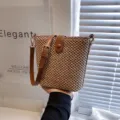 Stylish straw bucket bag for women, casual woven cross body handbag with adjustable strap. - Brown