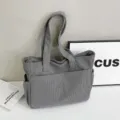 Detail view of grey corduroy tote bag, large shoulder bag with front pocket design. - Light Gray