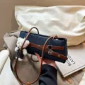 Denim underarm shoulder bag for women, stylish brown belt design with cute white bear pendant. - Brown