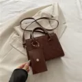 Dark brown quilted satchel bag with crossbody strap and coin purse charm stylish. - Coffee