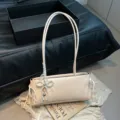 Stylish off-white shoulder bag for women, chic pearl bow design, elegant commuting underarm bag. - With Pendant / White