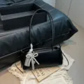Black shoulder bag for women, chic pearl bow and lace accent, elegant commuter armpit bag - With Pendant / Black