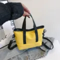 Casual yellow canvas crossbody bag for women, trendy daily shoulder tote with black handles. - Yellow