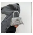 Mini bolso cruzado plateado con purpurina para mujer, elegante bolso con lazo de cristal. - Plateado