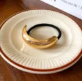 Black hair tie with a sleek gold-tone curved metal decoration for elegant daily hairstyles. - Rose Gold Metal Hair Tie / Single Layer / Rose Gold