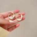 Twisted gold-rimmed white enamel hoop earrings, chic minimalist design for women fashion daily wear. - White C-Shaped Silver Post Earrings