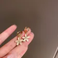 Gold Flower Hoop Earrings with White Cat's Eye Stone and Crystal Center for Women Daily Wear - Gold Flower Huggie Earrings