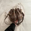 Chic brown plaid bucket bag with PU leather drawstring and shoulder strap for daily use. - With Ornament / Brown