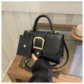 Black trendy women shoulder crossbody bag with top handle and stylish golden metal buckle detail. - Black