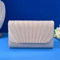 Champagne pleated evening clutch bag detailed view, elegant bridal handbag for formal events. - Off White