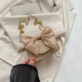 Cute bow crossbody bag for women, stylish beige PU leather shoulder handbag with gold chain. - Khaki