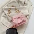 Cute pink crossbody bag for women with large organza bow and chic gold chain strap. - Pink