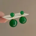 Green double ball stud earrings, front-back design with gold tone accent on card. - 67# Front Back Double Ball Green Resin Spherical Style