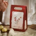 Red paper gift box featuring romantic rose and butterfly illustrations, ideal for candy and party favors. - Butterfly Rose Style A