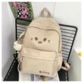Cute beige canvas school backpack for girls, casual lightweight daypack with lovely cartoon face. - Apricot Pink