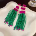 Statement long beaded tassel earrings featuring vibrant green beads and hot pink geometric links. - 144# Tassel