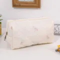 Quilted cosmetic bag with cute bow embroidery, large capacity daily makeup organizer pouch. - White