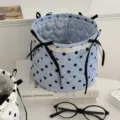 Cute blue polka dot quilted storage basket with black bows for desktop organization and decor. - Blue