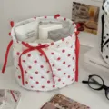 Quilted fabric storage basket with red polka dots, cute bows and lace trim for desktop organization. - Red