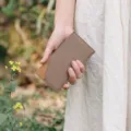 Minimalist bi-fold leather card wallet detail view, elegant two-tone slim design for daily use - Khaki