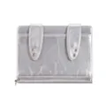 Detailed view of silver metallic passport holder with cute bunny ear design and metal eyelet accents. - Silver