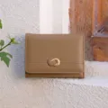 Minimalist solid color tri-fold wallet for women with card slots and metal buckle design. - Milk Tea