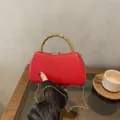 Red PU hard shell box bag with metallic beaded handle and elegant chain strap for evening party. - Box Bag / Red