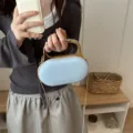 Light blue acrylic handbag with gold metal handle and chain strap for women chic daily use - Blue