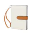 Detailed view of the chic two-tone passport wallet, multi-functional design for women. - White