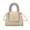 Detail view of a handmade pearl and silver beaded mini handbag with crossbody chain strap. - L / Off White