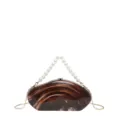 Acrylic clutch bag detail showing the unique brown marble pattern and elegant faux pearl handle. - Brown with Pendant