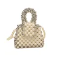 Close-up detail of handmade beaded handbag with white faux pearls and metallic silver beads. - S / Off White