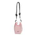 Detailed view of the pink mesh bottle bag, showing textured fabric and adjustable strap. - Pink