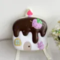 Cute cake design children backpack detail view with chocolate and strawberry motifs. - Brown